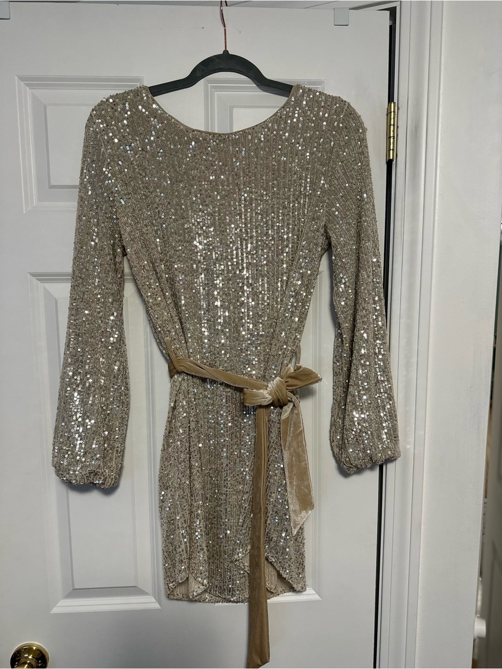 Storia Sequin Long Sleeve Mini Dress in Champagne Gold with Velvet Tie